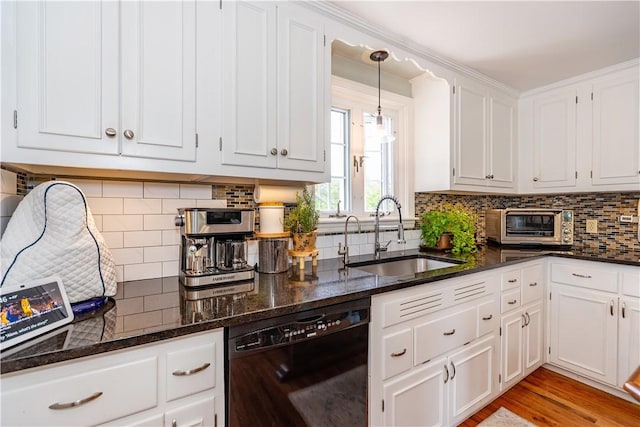 170 Pilgrim Pkwy, Warwick, RI 02888 - kitchen featuring black dishwasher, a sink, white cabinets, dark stone counters, and tasteful backsplash