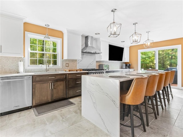 511 Central Pike, Scituate, RI 02857 - kitchen featuring wall chimney exhaust hood, stainless steel dishwasher, a sink, and tasteful backsplash