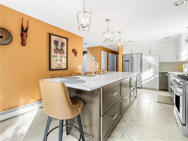 511 Central Pike, Scituate, RI 02857 - kitchen with premium appliances, a chandelier, light countertops, tasteful backsplash, and recessed lighting