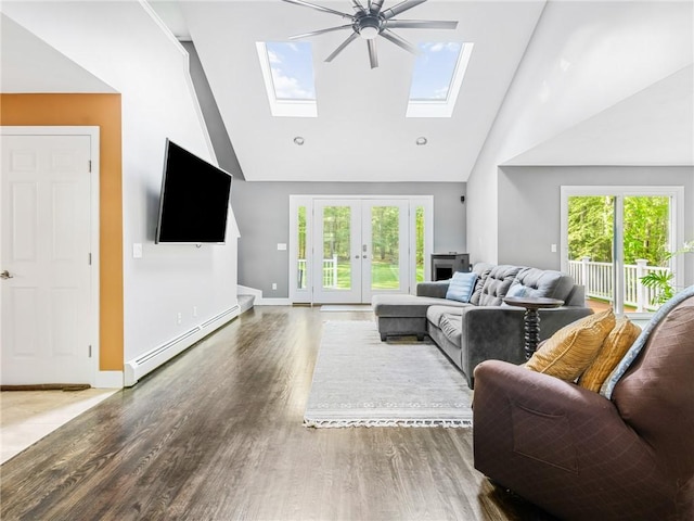 511 Central Pike, Scituate, RI 02857 - living room with a baseboard heating unit, a skylight, high vaulted ceiling, wood finished floors, and healthy amount of natural light