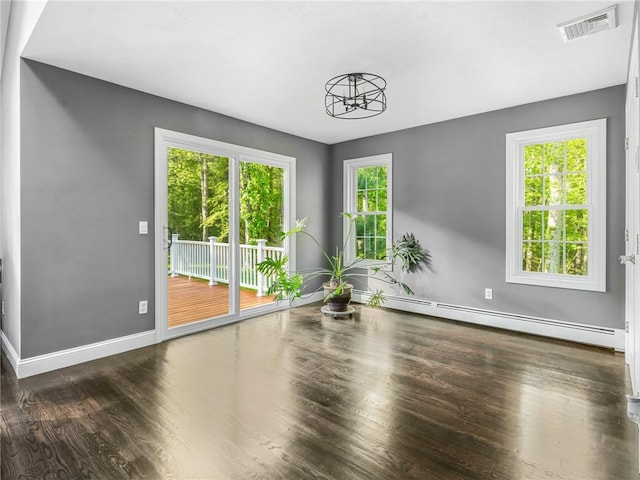 511 Central Pike, Scituate, RI 02857 - spare room featuring a baseboard radiator, wood finished floors, and baseboards
