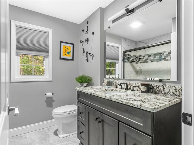 511 Central Pike, Scituate, RI 02857 - bathroom featuring marble finish flooring, vanity, toilet, tiled shower, and healthy amount of natural light