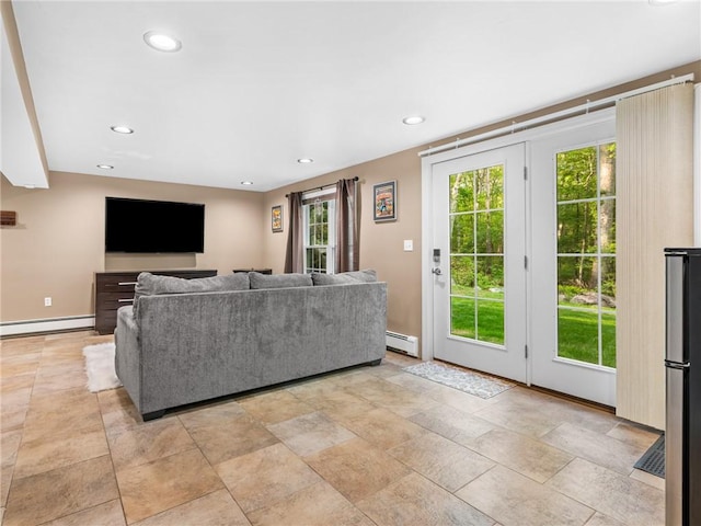 511 Central Pike, Scituate, RI 02857 - living area featuring a baseboard radiator, recessed lighting, and baseboards