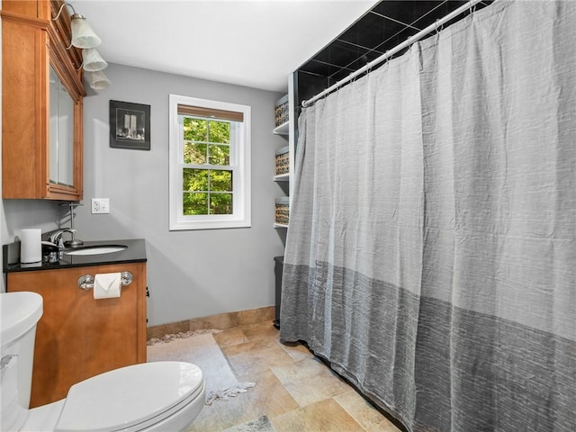 511 Central Pike, Scituate, RI 02857 - bathroom featuring toilet, stone finish flooring, vanity, and baseboards