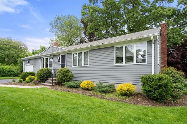 45 Landon Rd, Warwick, RI 02888 - single story home with an attached garage, a chimney, and a front yard