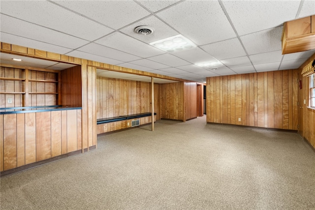 45 Landon Rd, Warwick, RI 02888 - basement featuring wooden walls and a drop ceiling