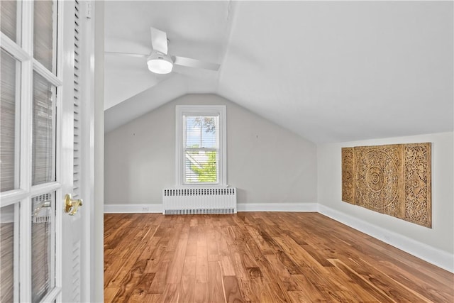 4 Red Cross Ave Unit 4, Newport, RI 02840 - additional living space with radiator, wood finished floors, lofted ceiling, baseboards, and a ceiling fan