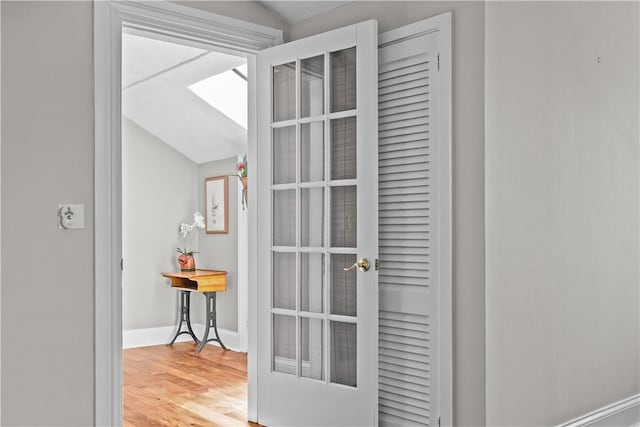 4 Red Cross Ave Unit 4, Newport, RI 02840 - corridor featuring lofted ceiling, wood finished floors, a skylight, and baseboards