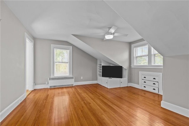 4 Red Cross Ave Unit 4, Newport, RI 02840 - bonus room with radiator, light wood-style flooring, vaulted ceiling, and plenty of natural light