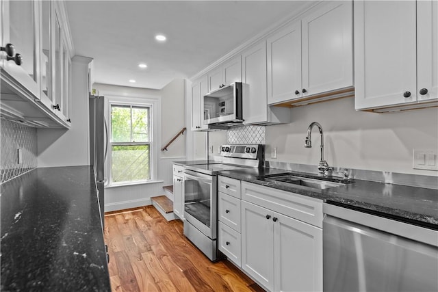 4 Red Cross Ave Unit 4, Newport, RI 02840 - kitchen with stainless steel appliances, a sink, white cabinets, and recessed lighting
