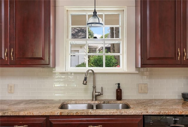 47 Lyndhurst Ave, Providence, RI 02908 - kitchen featuring a sink, dishwashing machine, dark brown cabinets, and light stone counters
