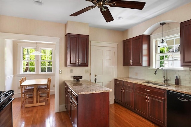 47 Lyndhurst Ave, Providence, RI 02908 - kitchen with a sink, black appliances, ceiling fan, light stone countertops, and wood finished floors
