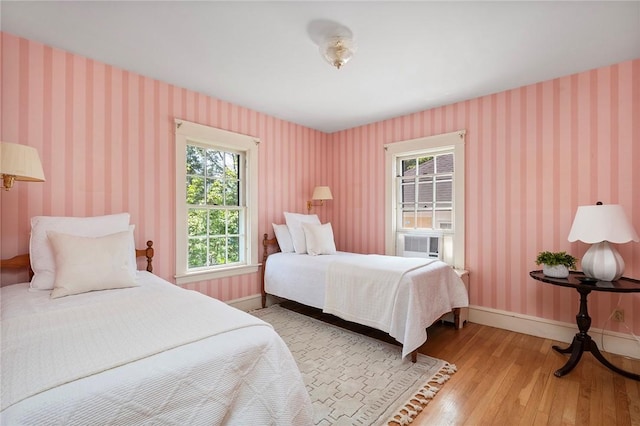 47 Lyndhurst Ave, Providence, RI 02908 - bedroom featuring wood finished floors, baseboards, and cooling unit