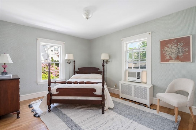 47 Lyndhurst Ave, Providence, RI 02908 - bedroom with radiator, wood finished floors, baseboards, and cooling unit