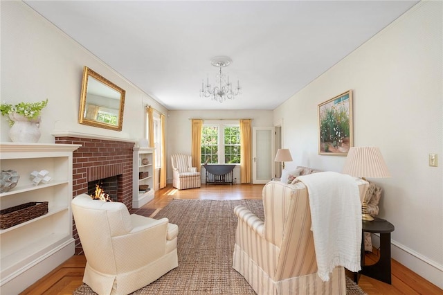 47 Lyndhurst Ave, Providence, RI 02908 - living room with a chandelier, a fireplace, baseboards, and wood finished floors