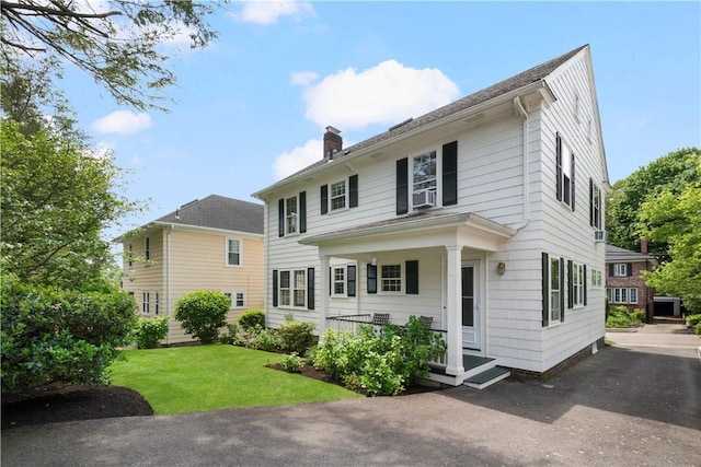 47 Lyndhurst Ave, Providence, RI 02908 - view of front of home with a chimney and a front yard