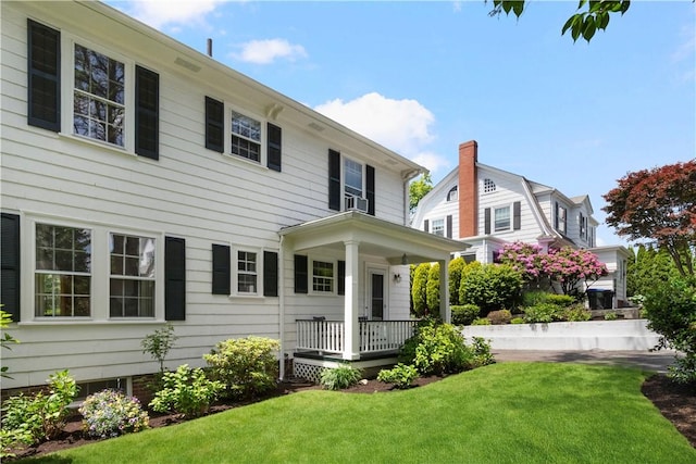 47 Lyndhurst Ave, Providence, RI 02908 - view of front of home featuring a porch, a front yard, and cooling unit