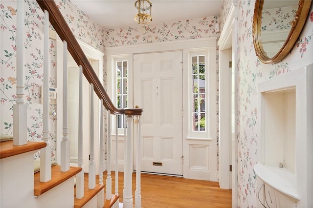 47 Lyndhurst Ave, Providence, RI 02908 - foyer featuring wallpapered walls, light wood-style floors, healthy amount of natural light, and stairway