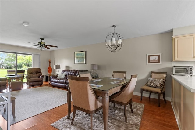30 Sweet Meadow Ct Unit 15, Narragansett, RI 02882 - dining area featuring wood finished floors, a chandelier, a ceiling fan, and baseboards