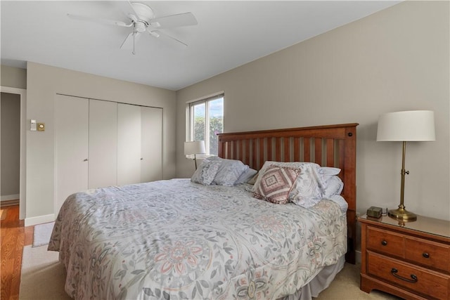 30 Sweet Meadow Ct Unit 15, Narragansett, RI 02882 - bedroom with a closet, a ceiling fan, light wood-style flooring, and baseboards