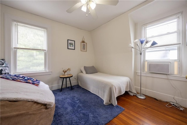 16 Malvern Ave, Cranston, RI 02905 - bedroom with multiple windows, baseboards, ceiling fan, and wood finished floors