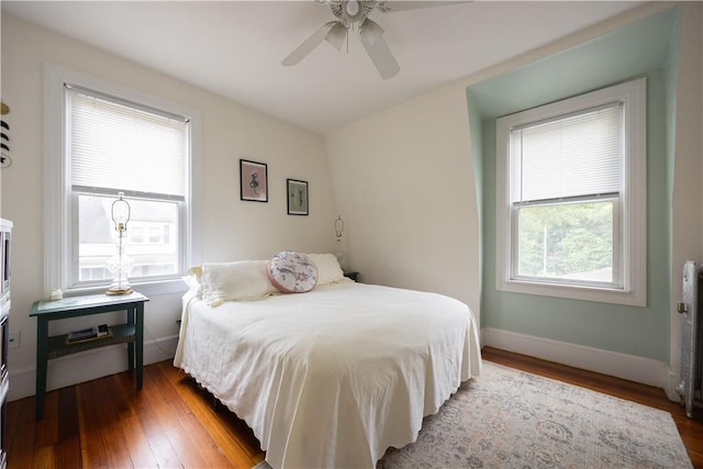 16 Malvern Ave, Cranston, RI 02905 - bedroom featuring wood-type flooring, baseboards, a ceiling fan, and radiator
