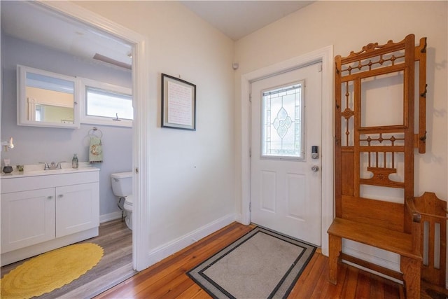 16 Malvern Ave, Cranston, RI 02905 - foyer entrance featuring healthy amount of natural light, light wood-style flooring, and baseboards