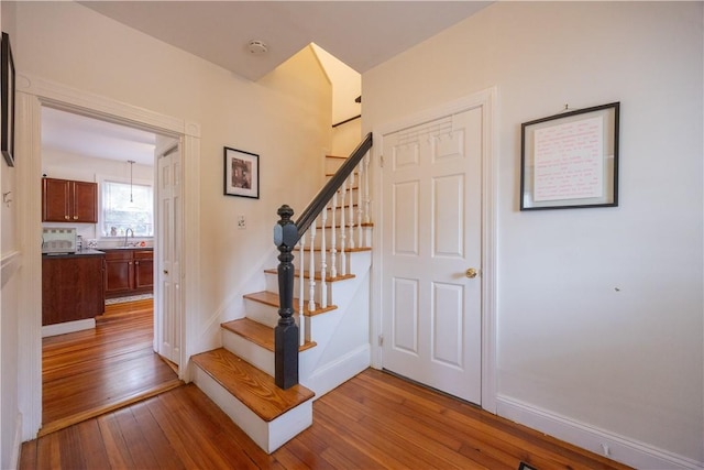 16 Malvern Ave, Cranston, RI 02905 - staircase with wood-type flooring and baseboards