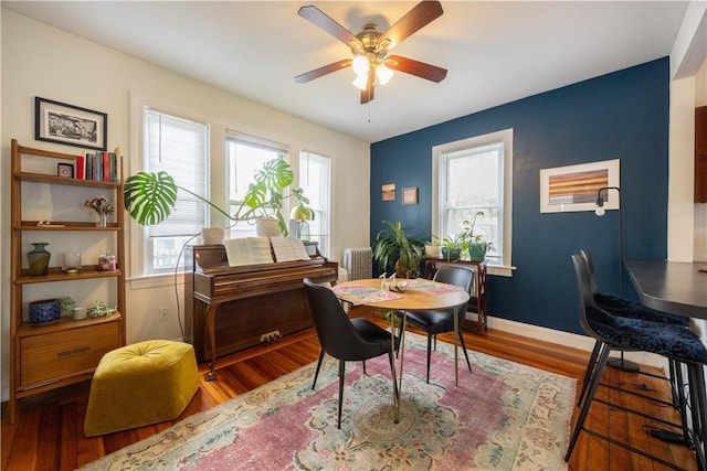 16 Malvern Ave, Cranston, RI 02905 - dining room with radiator, ceiling fan, wood finished floors, and baseboards