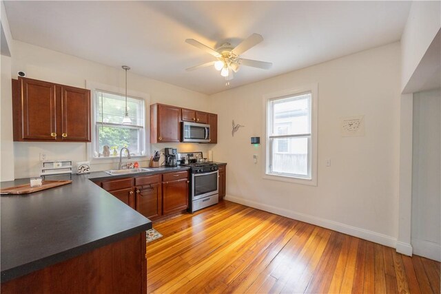 16 Malvern Ave, Cranston, RI 02905 - kitchen featuring stainless steel appliances, a sink, dark countertops, and healthy amount of natural light