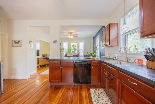 16 Malvern Ave, Cranston, RI 02905 - kitchen with black dishwasher, dark countertops, dark wood-style flooring, and a peninsula