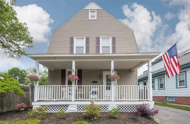 16 Malvern Ave, Cranston, RI 02905 - farmhouse featuring a porch and a gambrel roof