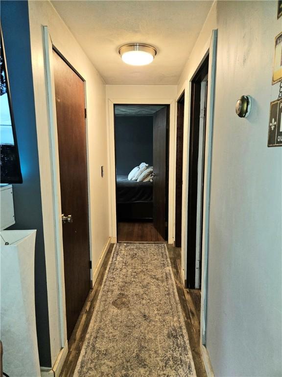 5 Martin St, Coventry, RI 02816 - corridor featuring dark wood-style floors
