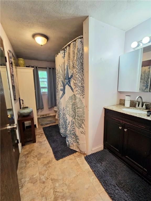 5 Martin St, Coventry, RI 02816 - full bath with vanity, a textured ceiling, and a shower with curtain