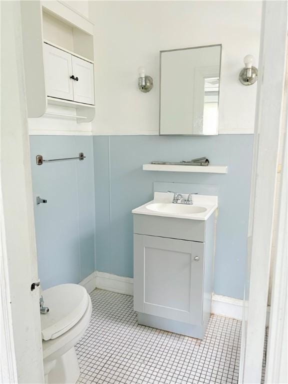 74 Pontiac St, Warwick, RI 02886 - half bathroom featuring vanity, toilet, and tile patterned flooring