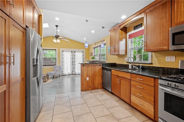882 Point Judith Rd, Narragansett, RI 02882 - kitchen with appliances with stainless steel finishes, vaulted ceiling, ceiling fan, plenty of natural light, and brown cabinetry
