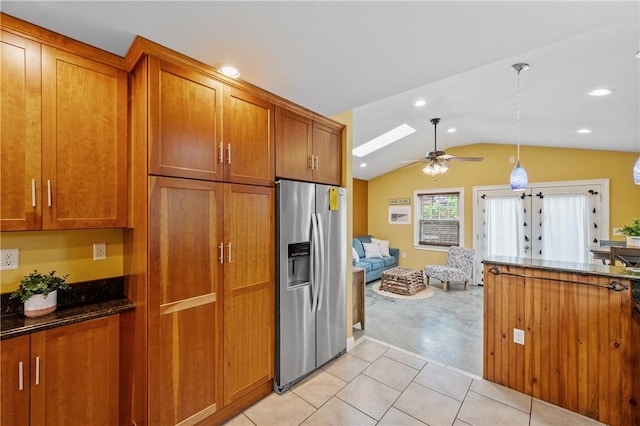 882 Point Judith Rd, Narragansett, RI 02882 - kitchen featuring stainless steel fridge with ice dispenser, brown cabinetry, light colored carpet, lofted ceiling, and a ceiling fan