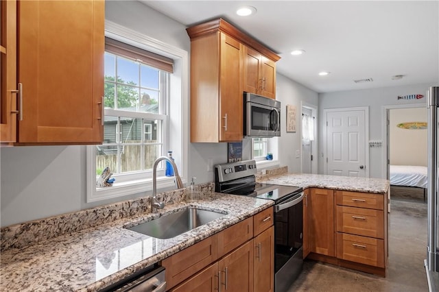 882 Point Judith Rd, Narragansett, RI 02882 - kitchen with appliances with stainless steel finishes, finished concrete floors, light stone counters, recessed lighting, and a peninsula
