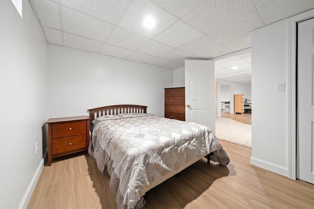 320 Beverage Hill Ave, Pawtucket, RI 02861 - bedroom featuring a paneled ceiling, light wood-type flooring, and baseboards