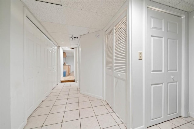 320 Beverage Hill Ave, Pawtucket, RI 02861 - hall with a paneled ceiling, light tile patterned floors, and baseboards