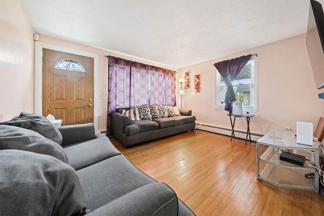 320 Beverage Hill Ave, Pawtucket, RI 02861 - living area featuring a baseboard heating unit and wood-type flooring