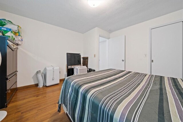 320 Beverage Hill Ave, Pawtucket, RI 02861 - bedroom with wood finished floors and baseboards