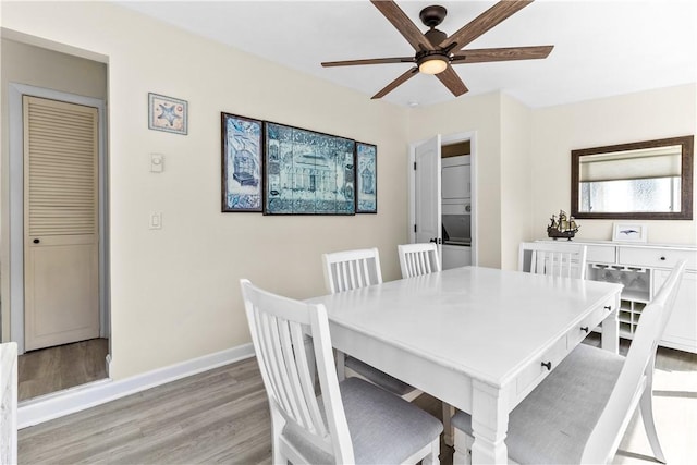 30 Brown St Unit 2, Narragansett, RI 02882 - dining space featuring light wood-type flooring, ceiling fan, and baseboards