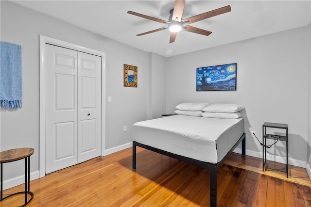 30 Brown St Unit 2, Narragansett, RI 02882 - bedroom with light wood-style flooring, baseboards, ceiling fan, and a closet