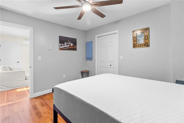 30 Brown St Unit 2, Narragansett, RI 02882 - bedroom featuring light wood-style flooring, baseboards, a closet, and a ceiling fan