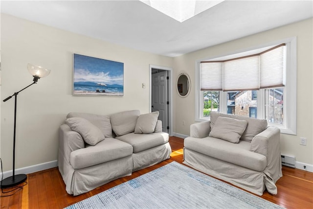 30 Brown St Unit 2, Narragansett, RI 02882 - living room featuring wood finished floors, baseboards, and a baseboard heating unit