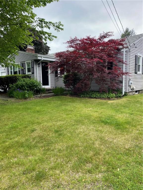11 Laurelhurst Rd, Cranston, RI 02920 - view of front of home featuring a front yard and a chimney