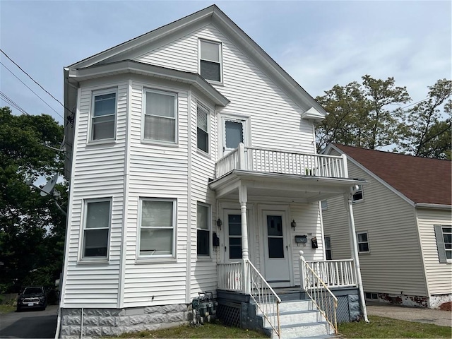 1097 Pontiac Ave, Cranston, RI 02910 - view of front of home featuring a balcony and a porch