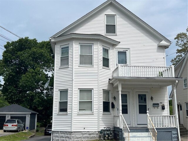 1097 Pontiac Ave, Cranston, RI 02910 - view of front facade with a balcony and covered porch