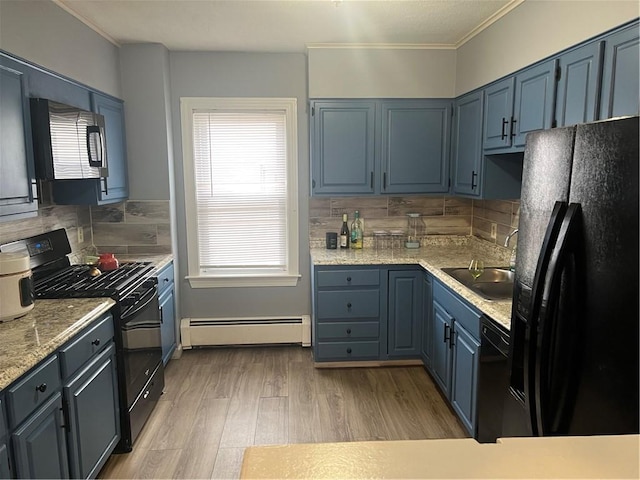 1097 Pontiac Ave, Cranston, RI 02910 - kitchen featuring black appliances, baseboard heating, a sink, decorative backsplash, and light wood-type flooring